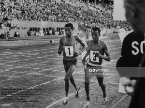Oromo (Oromian) athletes Abebe Bikila (L) and Mamo Wolde Dagaga (R) in exhibition race at Berlin Olympic Stadium. (Photo by Robert Lackenbach.The LIFE Picture Collection.Getty Images)